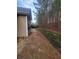 Private backyard with wooden retaining wall and patio at 658 Austin Creek Dr, Buford, GA 30518