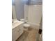 Clean bathroom with white tub, toilet, and vanity at 658 Austin Creek Dr, Buford, GA 30518