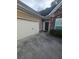 Two-car garage with attached driveway at 658 Austin Creek Dr, Buford, GA 30518