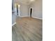 Spacious living room with gray walls and wood-look flooring at 658 Austin Creek Dr, Buford, GA 30518