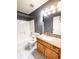 Bathroom features granite vanity and tiled floors at 12384 Riviera Dr, Fayetteville, GA 30215