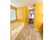 Bathroom with bathtub, shower, and double vanity at 12384 Riviera Dr, Fayetteville, GA 30215