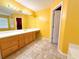 Bright bathroom with double vanity and wood cabinets at 12384 Riviera Dr, Fayetteville, GA 30215