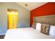 Spacious primary bedroom with king-size bed and en-suite bathroom access at 12384 Riviera Dr, Fayetteville, GA 30215
