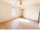 Bright bedroom with wood-look flooring and ample closet space at 12384 Riviera Dr, Fayetteville, GA 30215