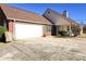 Ranch-style home with attached garage and landscaping at 12384 Riviera Dr, Fayetteville, GA 30215