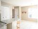 Eat-in kitchen with granite countertops and white cabinets at 12384 Riviera Dr, Fayetteville, GA 30215