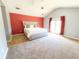 Large main bedroom with carpeted floors and access to patio at 12384 Riviera Dr, Fayetteville, GA 30215