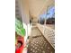 Covered front porch with lattice detailing at 12384 Riviera Dr, Fayetteville, GA 30215