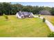 Farmhouse with long driveway and large grassy yard at 350 Taylor Path, Dallas, GA 30157