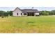 Large backyard with grassy area and home view at 350 Taylor Path, Dallas, GA 30157