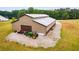 Tan barn with three garage doors and tractor at 350 Taylor Path, Dallas, GA 30157