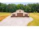 Tan barn with three large brown garage doors at 350 Taylor Path, Dallas, GA 30157