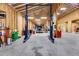 Spacious barn interior with high ceilings, concrete floor, and car lift at 350 Taylor Path, Dallas, GA 30157