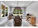 Rustic dining room with wood table, chairs, and a wagon wheel chandelier at 350 Taylor Path, Dallas, GA 30157