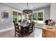 Bright dining room with large windows and farmhouse-style table and chairs at 350 Taylor Path, Dallas, GA 30157