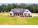 Two-story farmhouse with white exterior, red door, and large windows at 350 Taylor Path, Dallas, GA 30157