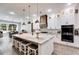 Open concept kitchen with island, white cabinets, and hardwood floors at 350 Taylor Path, Dallas, GA 30157