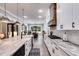 Modern kitchen with large island, white cabinets, and granite countertops at 350 Taylor Path, Dallas, GA 30157