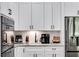 Kitchen with white cabinets, granite counters, and stainless steel appliances at 350 Taylor Path, Dallas, GA 30157