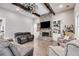 Living room with hardwood floors, a brick fireplace, and a large farmhouse fan at 350 Taylor Path, Dallas, GA 30157
