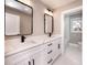 Double vanity bathroom with white cabinets and quartz countertops at , Loganville, GA 30052