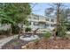 Shared backyard with patio furniture and ample green space at 381 10Th Ne St # 5, Atlanta, GA 30309