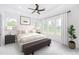 Bright and airy bedroom with ample natural light and a large bed at 6315 Wallace Farms Dr, Cumming, GA 30028