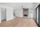 Living room with fireplace, hardwood floors, and sliding doors at 6315 Wallace Farms Dr, Cumming, GA 30028