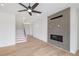 Light and airy living room with fireplace and hardwood floors at 6315 Wallace Farms Dr, Cumming, GA 30028