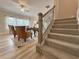 Staircase with wood and metal railing leading to the second floor at 1292 Fern Ridge Ct # 80, Norcross, GA 30093