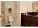 Bathroom with a vessel sink and floral shower curtain at 303 Breezy Hill Walk, Stockbridge, GA 30281