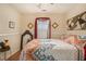 Bedroom with a queen-size bed and unique decor at 303 Breezy Hill Walk, Stockbridge, GA 30281