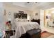 Main bedroom with ensuite bathroom access and a king-size bed at 303 Breezy Hill Walk, Stockbridge, GA 30281