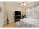 Bedroom with a queen-size bed and a ceiling fan at 303 Breezy Hill Walk, Stockbridge, GA 30281