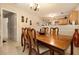 Dining room with a wooden table and access to kitchen at 303 Breezy Hill Walk, Stockbridge, GA 30281