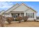 Charming one-story house with a well-manicured lawn and shrubs at 303 Breezy Hill Walk, Stockbridge, GA 30281