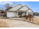House with driveway and landscaping at 303 Breezy Hill Walk, Stockbridge, GA 30281