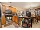 Kitchen with stainless steel appliances and wood cabinets at 303 Breezy Hill Walk, Stockbridge, GA 30281