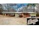 Single story home with carport, covered porch and landscaped yard at 952 Frashier Rd, Carrollton, GA 30116