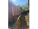 Brick home side view, showing a wooden deck and fenced backyard at , Decatur, GA 30032