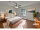 Staged bedroom with natural light, comfortable bed, and modern decor at 2268 Turtle Club Ne Dr, Marietta, GA 30066