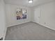 Spacious bedroom with grey carpeting and large window at 2268 Turtle Club Ne Dr, Marietta, GA 30066