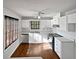 Kitchen with white cabinets, stainless steel appliances, and wood floors at 2268 Turtle Club Ne Dr, Marietta, GA 30066