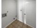 A compact laundry area with tile flooring and a utility connection at 2268 Turtle Club Ne Dr, Marietta, GA 30066