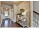 Entryway with hardwood floors, console table, and mirror at 3110 Deercrest Ct # 107, Cumming, GA 30040