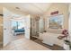 Bathroom with soaking tub, shower, and view into bedroom at 4851 Planters Walk, Douglasville, GA 30135