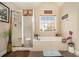 Bathroom with soaking tub, shower, and double vanity at 4851 Planters Walk, Douglasville, GA 30135