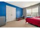 Spacious bedroom with blue and gray walls, a double door closet and window at 4851 Planters Walk, Douglasville, GA 30135