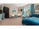 Bedroom with teal colored theme, featuring two armchairs and a window at 4851 Planters Walk, Douglasville, GA 30135